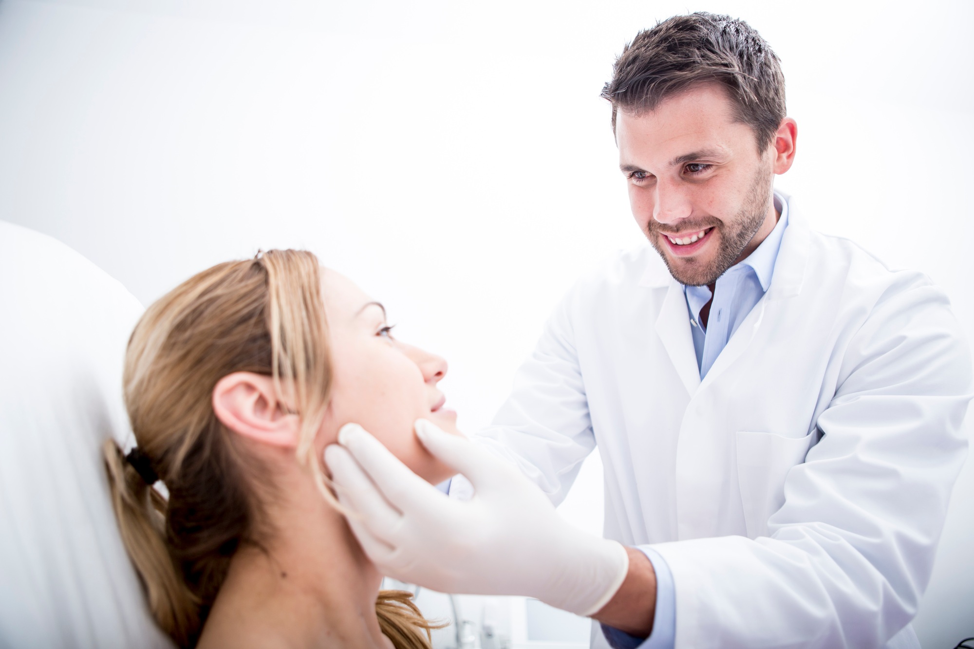 Aesthetic surgery, doctor examining woman